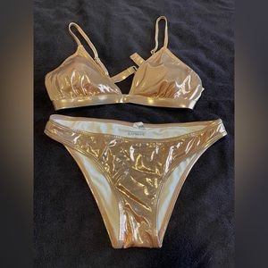Express shiny gold, two-piece swimsuit, worn once. Large top, medium bottom.